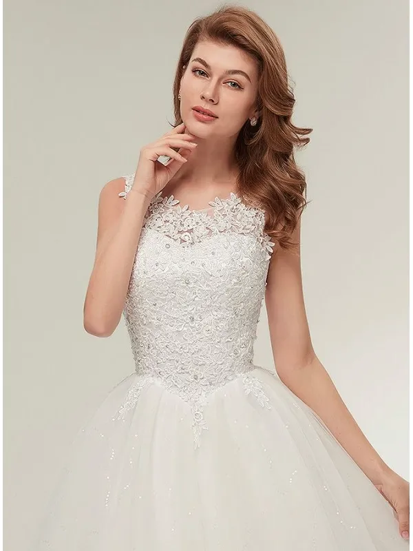Abito da Sposa con corpetto in pizzo macramè con bretelle e gonna glitter ampia